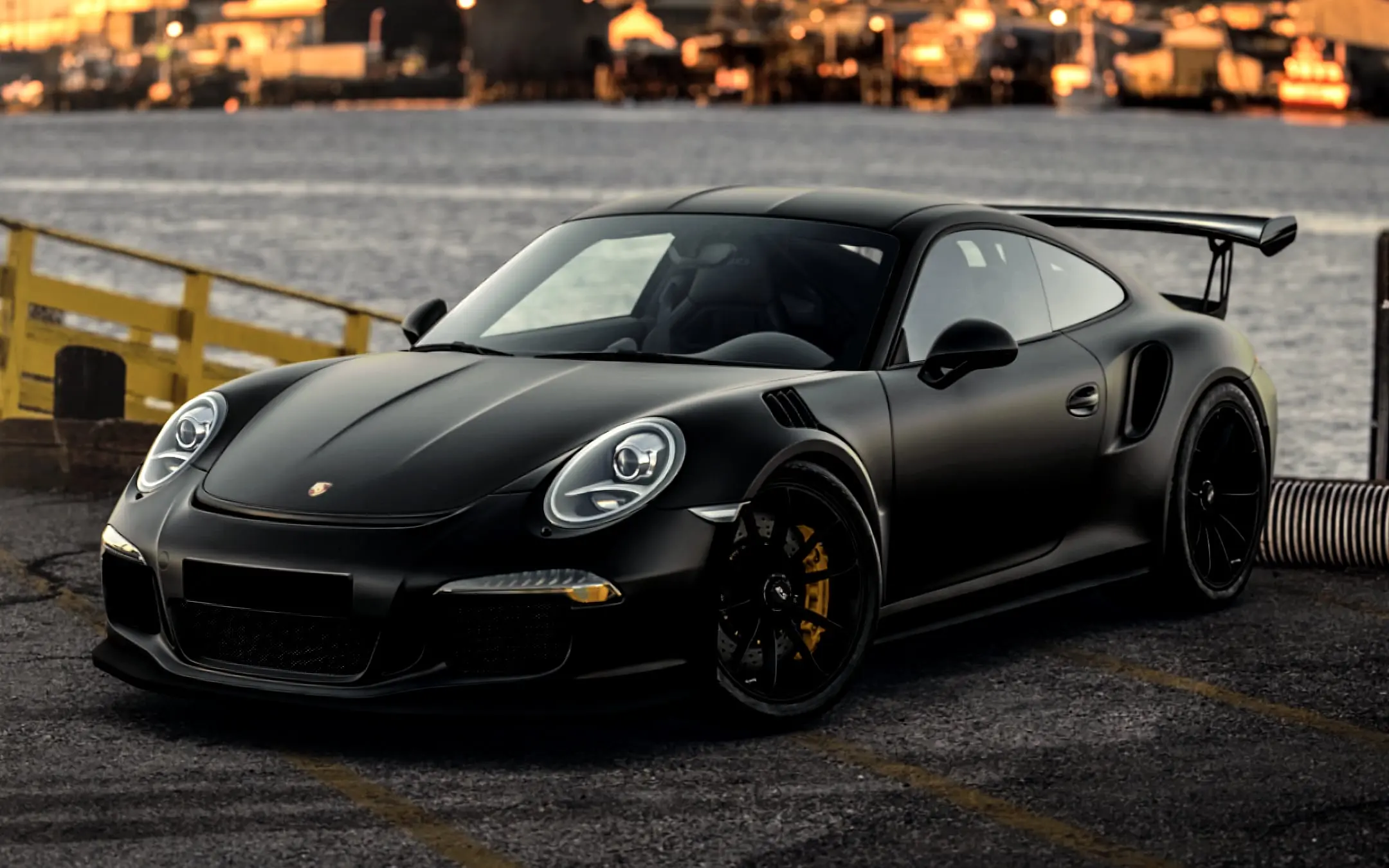 The same Porsche after detailing: deep, clear paint with sharp reflections